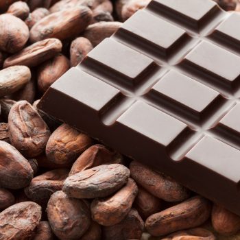 Bar of chocolate with raw cocoa beans